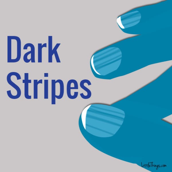 Dark Stripes Running Down Nails